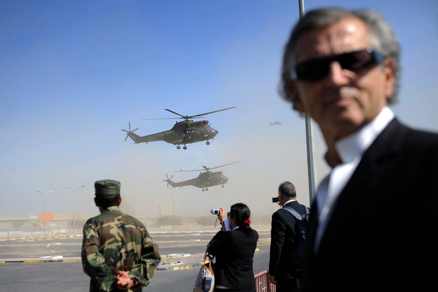 Lévy waits for the arrival of French President Nicolas Sarkozy, British Prime Minister David Cameron, and Libyan National Transitional Council leaders at the Tripoli Medical Center on Sept. 15, 2011.