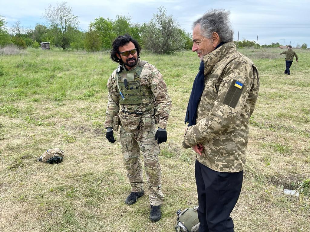 Bernard-Henri Lévy talking to one of the members of the Mozart Group in April 2022.